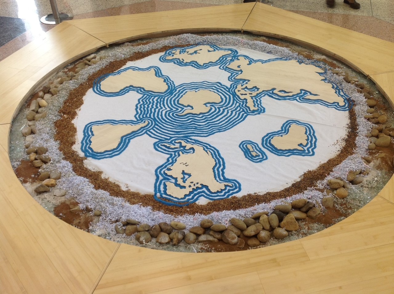 Mandala of the world in sand and stone