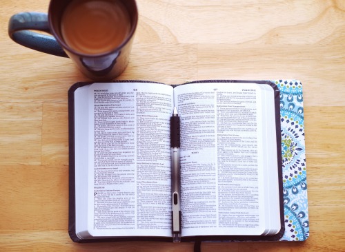 open bible with coffee